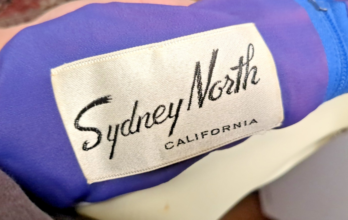 Sydney North designed, Hollywood Glamour, Striking V-neck blue party dress