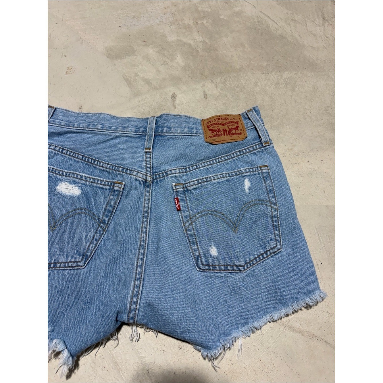 Levi&rsquo;s 501 Light Blue Distressed Denim Shorts button fly 27