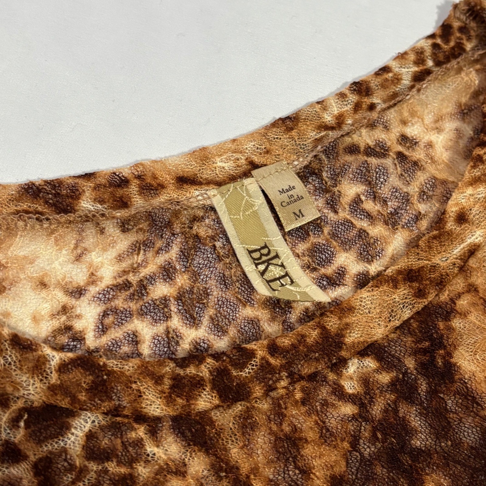 BKE Stunning vintage Y2k long sleeve sheer top with leopard print design