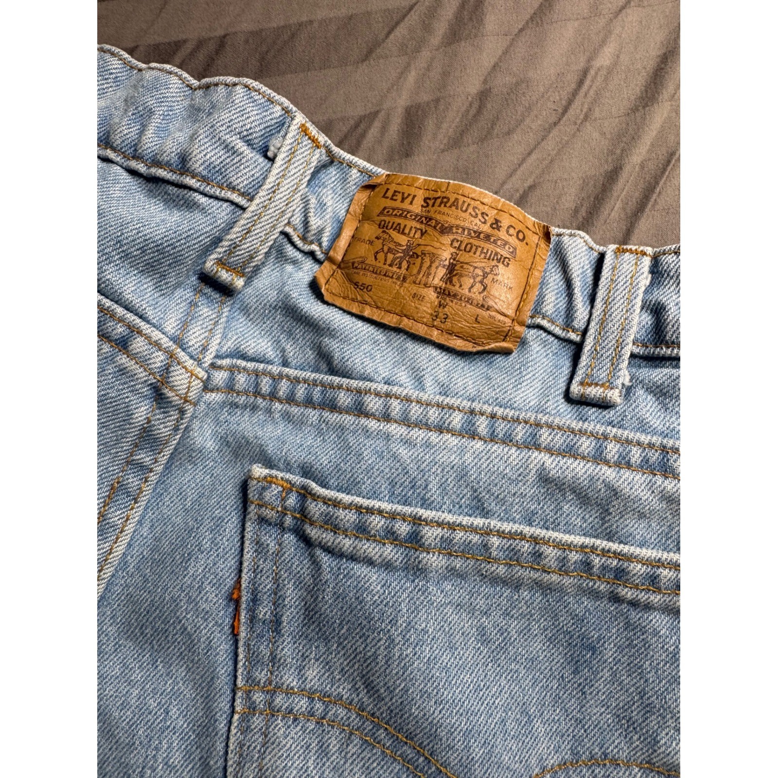 Vintage Levis 550 Orange Tab Light Wash Relaxed Tapered Jeans 33×28 Made in USA