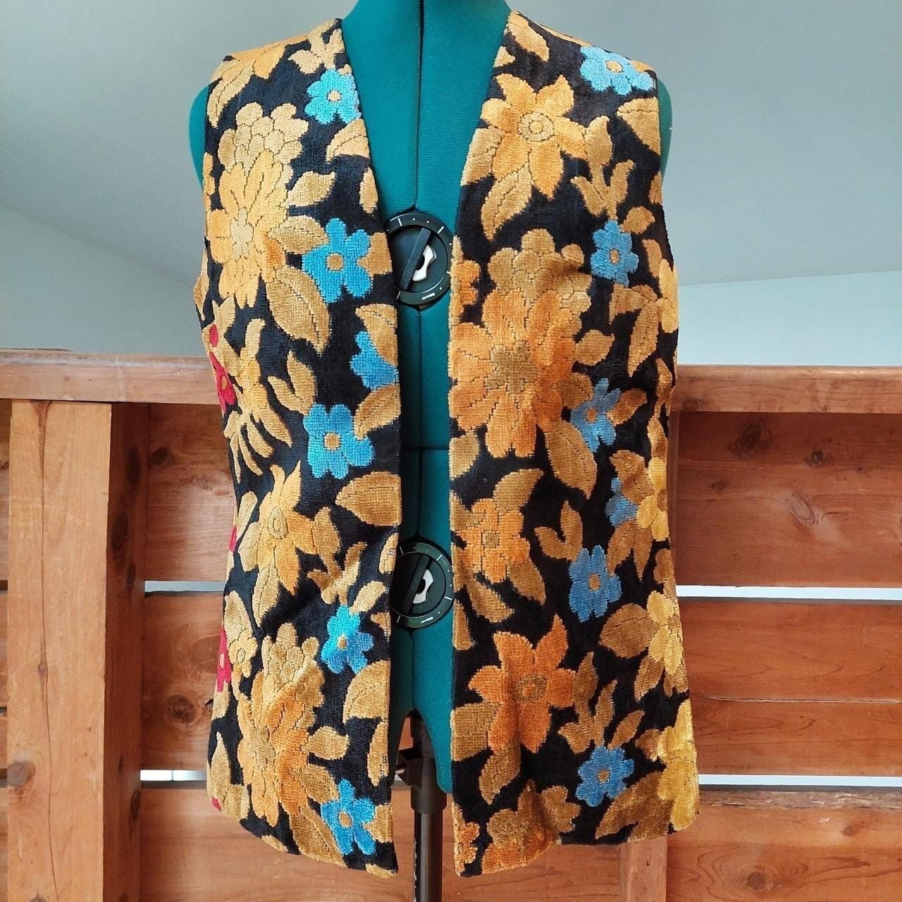 Vintage black, gold, blue, and red carpet vest.