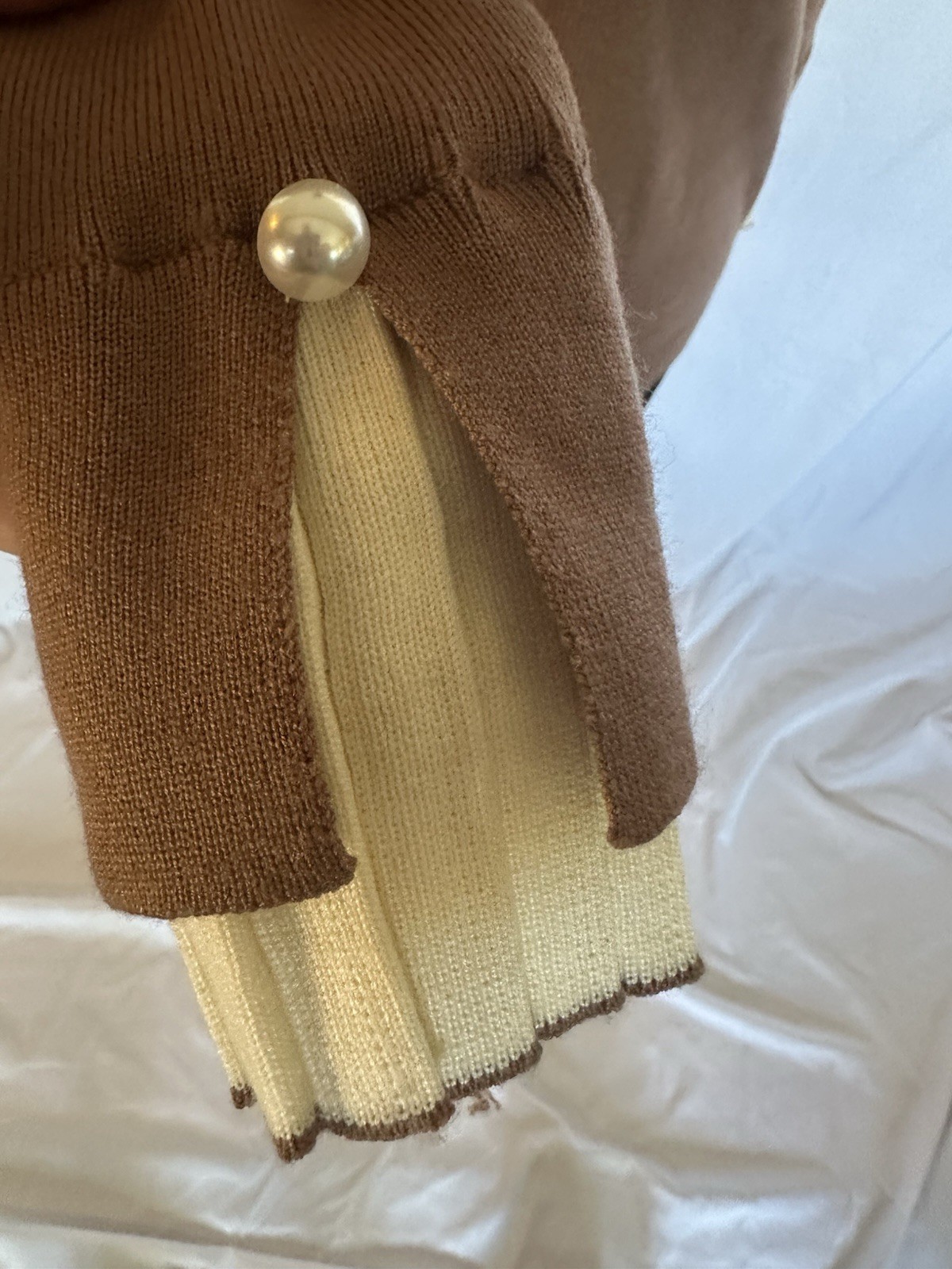 Brown Knit Sweater with Cream Pleated Trim and Pearl Button Detail